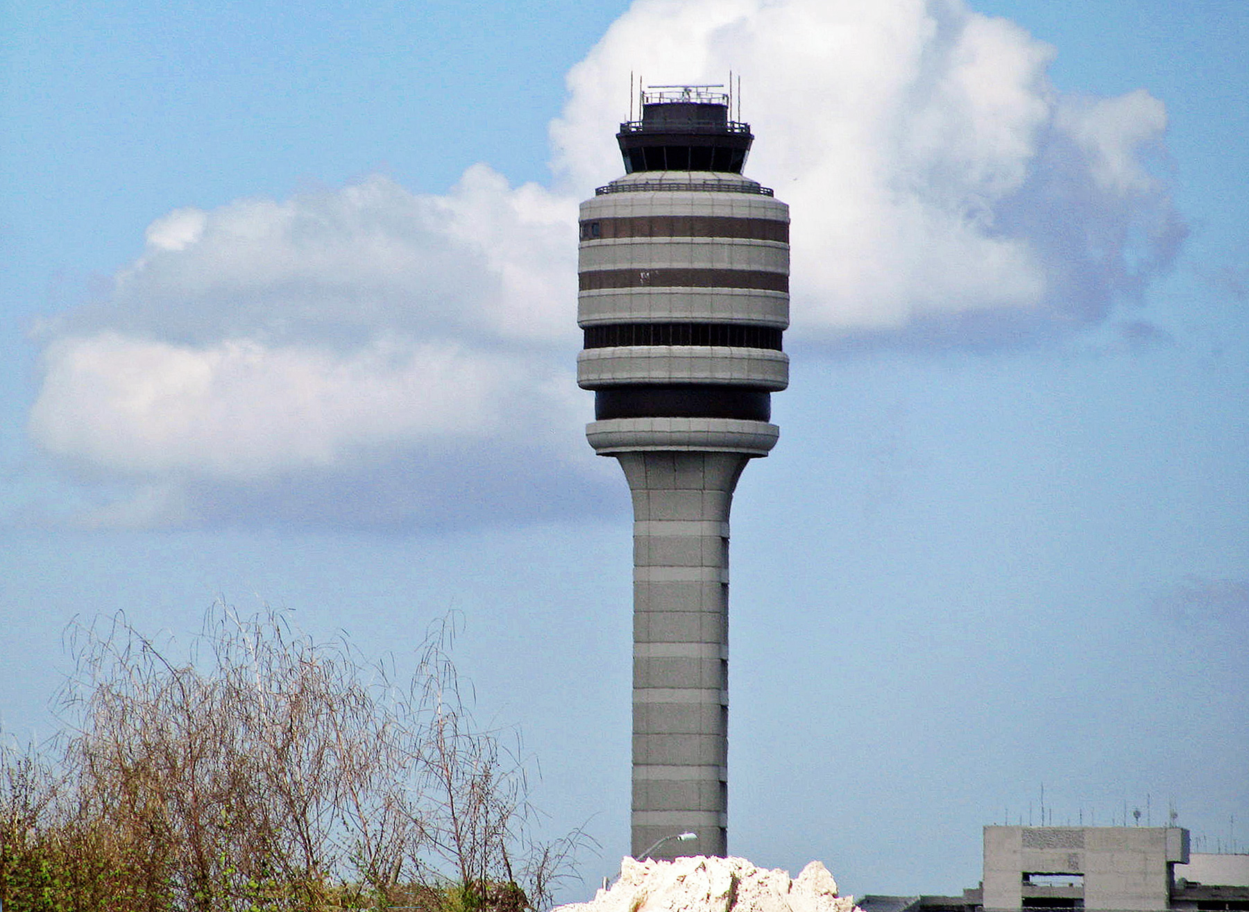 Orlando International Airport control tower beneath a blue sky